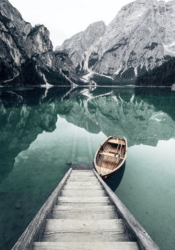 Original photo: a wooden rowboat beside a dock on a still mountain lake